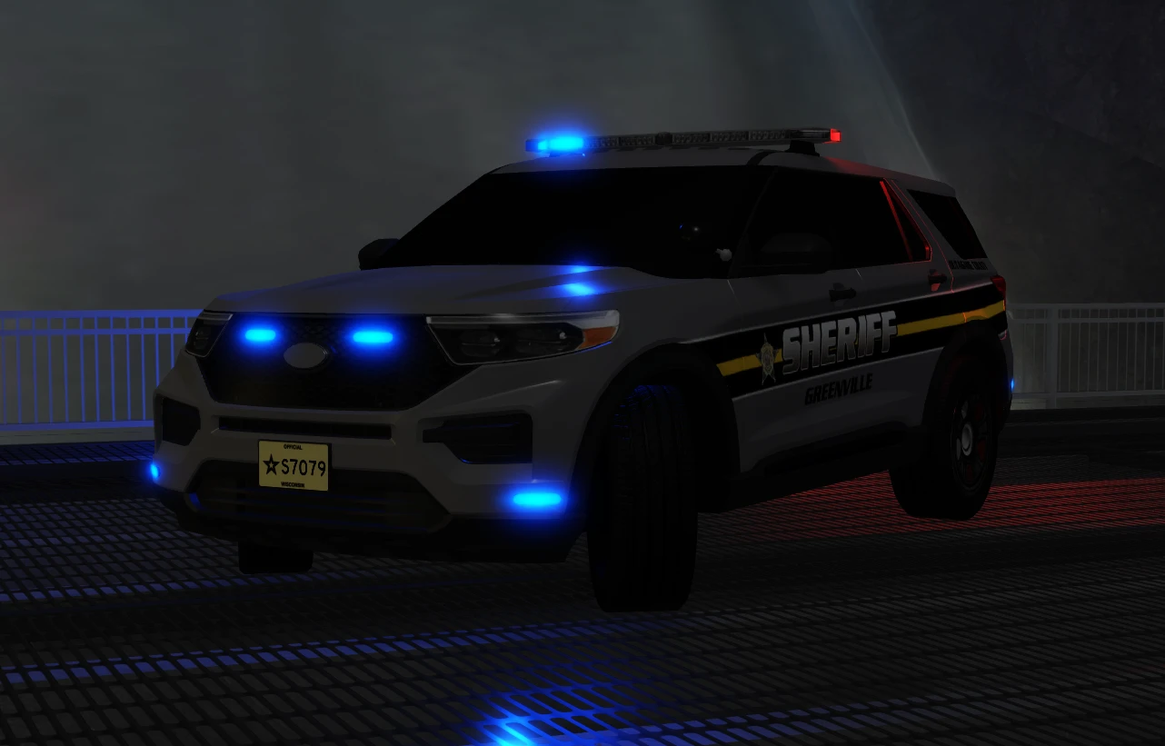 A Greenville Sheriff SUV with its blue lights on.